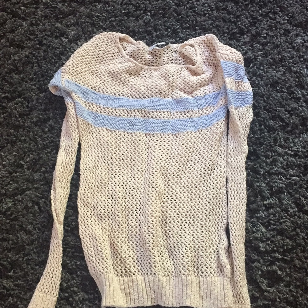 Knit blue and cream colored sweater
